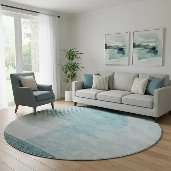 8' Teal And Ivory Geometric Washable Round Rug With UV Protection Photo 1