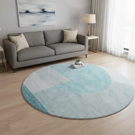 8' Teal And Ivory Geometric Washable Round Rug With UV Protection Photo 2
