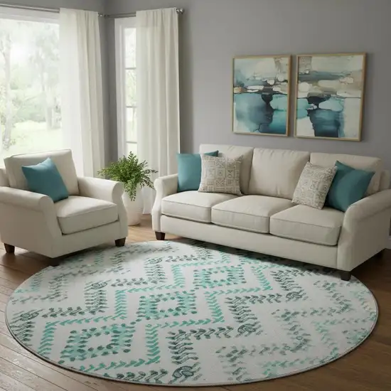 8' Teal And Ivory Geometric Washable Round Rug With UV Protection Photo 1