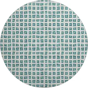 Photo of 8' Teal And Ivory Geometric Washable Round Rug With UV Protection