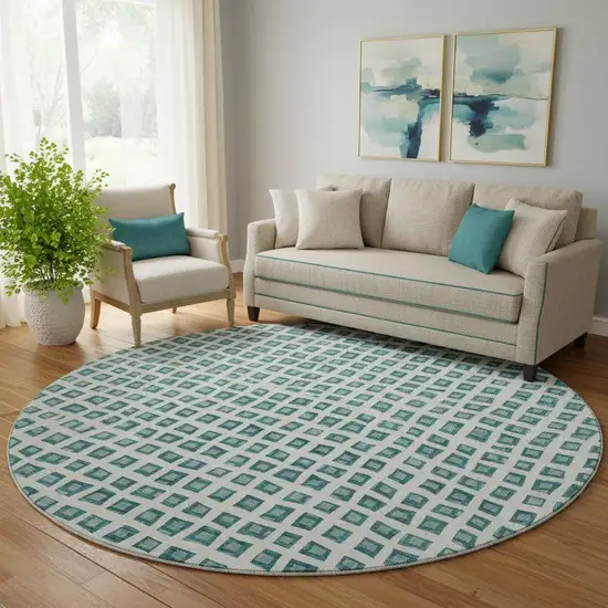 8' Teal And Ivory Geometric Washable Round Rug With UV Protection Photo 1
