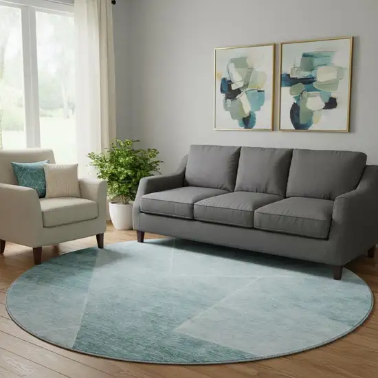 8' Teal And Ivory Geometric Washable Round Rug With UV Protection Photo 1