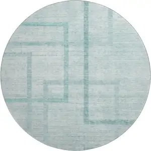 Photo of 8' Teal And Ivory Geometric Washable Round Rug With UV Protection
