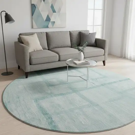8' Teal And Ivory Geometric Washable Round Rug With UV Protection Photo 2