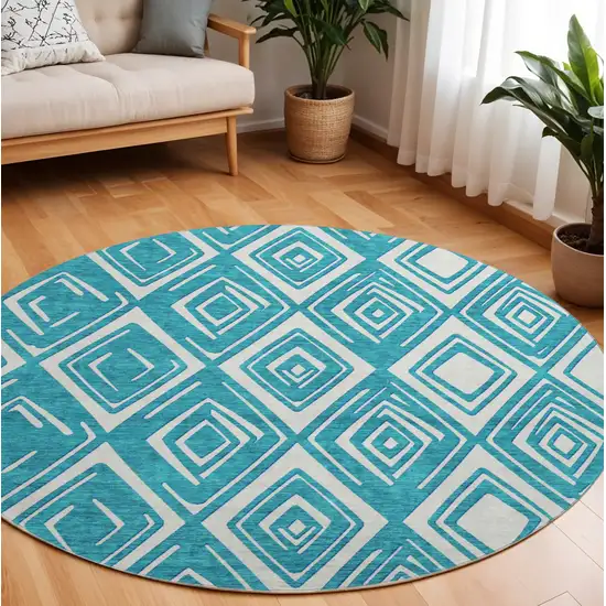 8' Teal And Ivory Geometric Washable Round Rug With UV Protection Photo 1