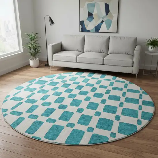 8' Teal And Ivory Geometric Washable Round Rug With UV Protection Photo 2