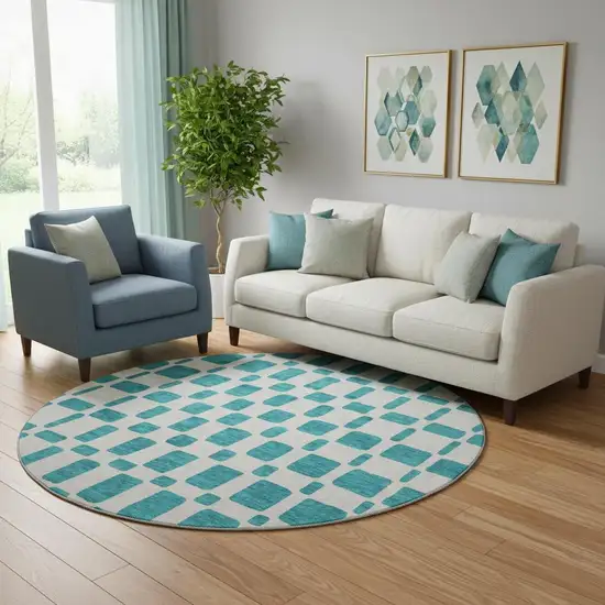 8' Teal And Ivory Geometric Washable Round Rug With UV Protection Photo 1