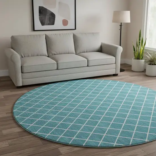 8' Teal And Ivory Geometric Washable Round Rug With UV Protection Photo 2