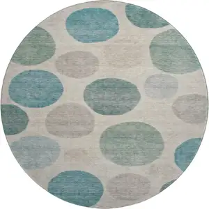 Photo of 8' Teal And Ivory Geometric Washable Round Rug With UV Protection