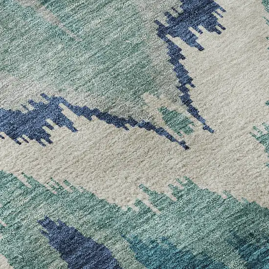 8' Teal And Ivory Ikat Washable Round Rug With UV Protection Photo 9