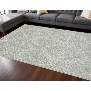 Photo of 8' Teal And Ivory Medallion Runner Rug With Fringe