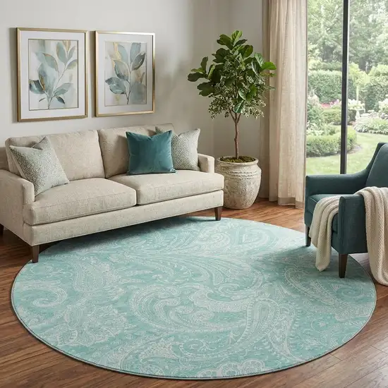 8' Teal And Ivory Paisley Washable Round Rug With UV Protection Photo 1