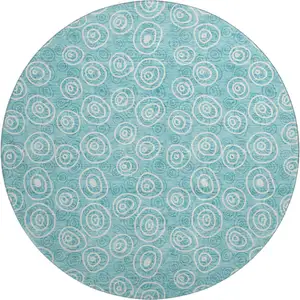 Photo of 8' Teal And Ivory Polka Dot Washable Round Rug With UV Protection