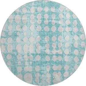 Photo of 8' Teal And Ivory Polka Dot Washable Round Rug With UV Protection