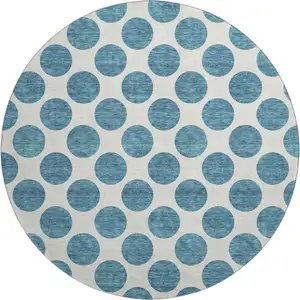 Photo of 8' Teal And Ivory Polka Dot Washable Round Rug With UV Protection