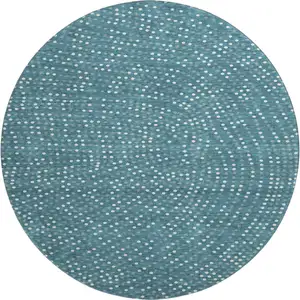 Photo of 8' Teal And Ivory Polka Dot Washable Round Rug With UV Protection