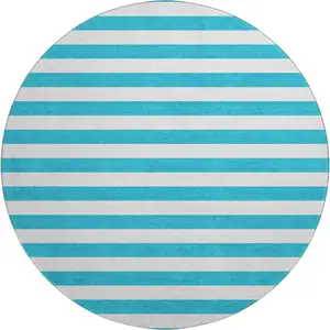 Photo of 8' Teal And Ivory Striped Washable Round Rug With UV Protection