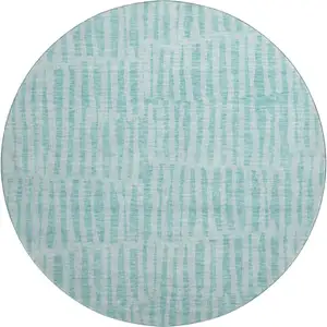 Photo of 8' Teal And Ivory Striped Washable Round Rug With UV Protection