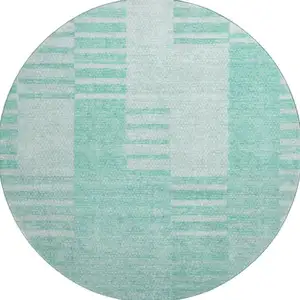 Photo of 8' Teal And Ivory Striped Washable Round Rug With UV Protection