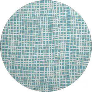 Photo of 8' Teal And Ivory Striped Washable Round Rug With UV Protection