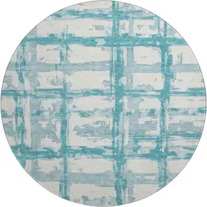Photo of 8' Teal And Ivory Striped Washable Round Rug With UV Protection