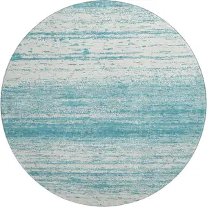 Photo of 8' Teal And Ivory Striped Washable Round Rug With UV Protection