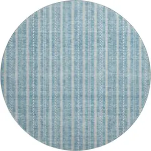 Photo of 8' Teal And Ivory Striped Washable Round Rug With UV Protection