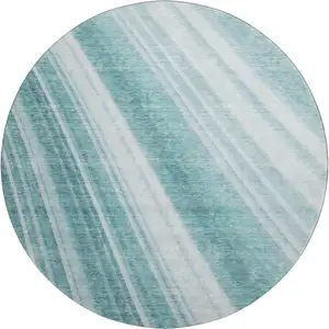 Photo of 8' Teal And Ivory Striped Washable Round Rug With UV Protection
