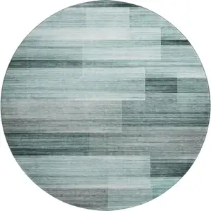 Photo of 8' Teal And Ivory Striped Washable Round Rug With UV Protection