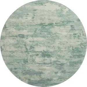 Photo of 8' Teal And Linen Abstract Washable Round Rug With UV Protection