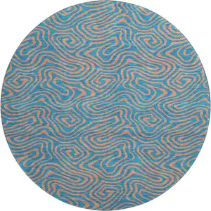 Photo of 8' Teal And Peach Abstract Washable Round Rug With UV Protection