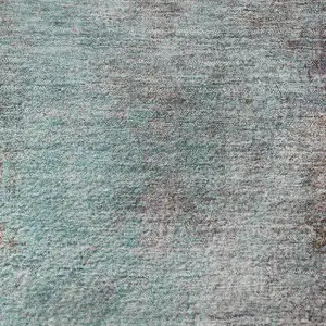 Photo of 8' Teal And Taupe Abstract Washable Round Rug With UV Protection
