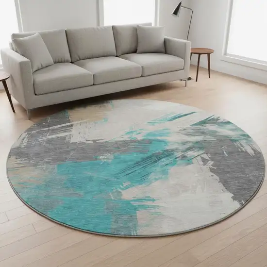 8' Teal Beige And Ivory Abstract Washable Round Rug With UV Protection Photo 2