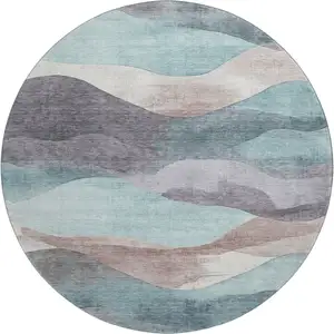 Photo of 8' Teal Beige And Ivory Abstract Washable Round Rug With UV Protection