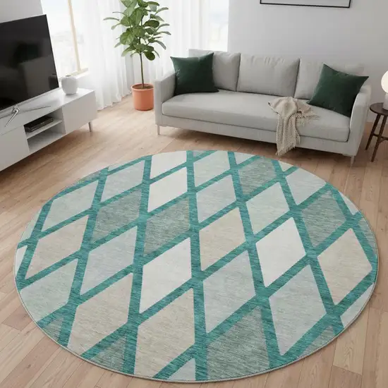 8' Teal Beige And Ivory Geometric Washable Round Rug With UV Protection Photo 2