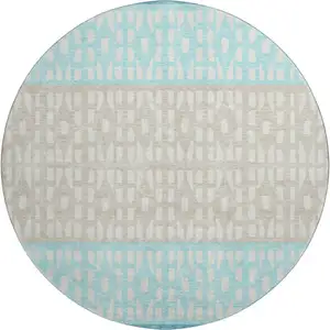 Photo of 8' Teal Beige And Ivory Geometric Washable Round Rug With UV Protection