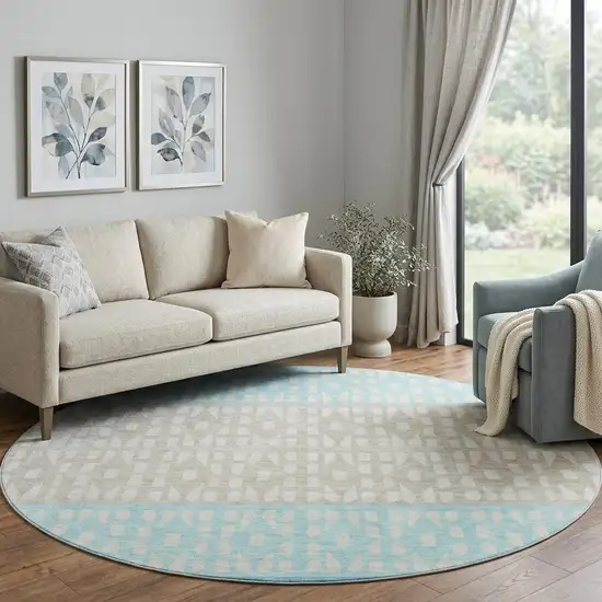 8' Teal Beige And Ivory Geometric Washable Round Rug With UV Protection Photo 1