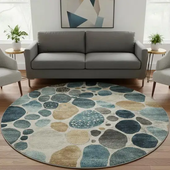 8' Teal Beige And Ivory Geometric Washable Round Rug With UV Protection Photo 2