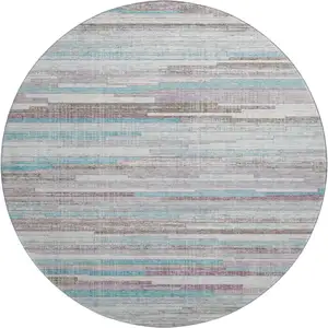 Photo of 8' Teal Beige And Ivory Striped Washable Round Rug With UV Protection