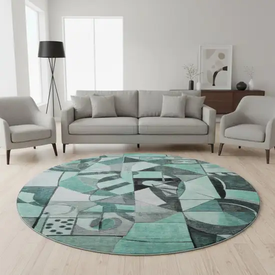 8' Teal Black And Ivory Abstract Washable Round Rug With UV Protection Photo 2