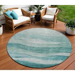 Photo of 8' Teal Blue And Aqua Round Abstract Washable Indoor Outdoor Area Rug