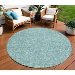 Photo of 8' Teal Blue And Aqua Round Floral Washable Indoor Outdoor Area Rug