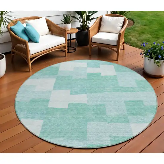 8' Teal Blue And Aqua Round Geometric Washable Indoor Outdoor Area Rug Photo 1