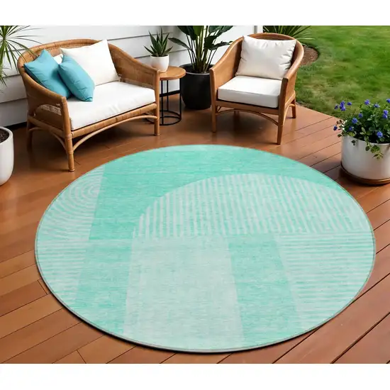 8' Teal Blue And Aqua Round Geometric Washable Indoor Outdoor Area Rug Photo 1