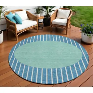 Photo of 8' Teal Blue And Aqua Round Striped Washable Indoor Outdoor Area Rug
