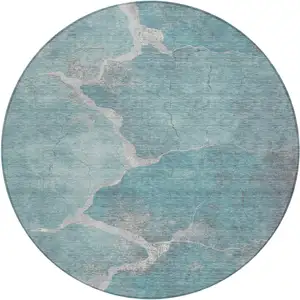 Photo of 8' Teal Blue And Beige Round Abstract Washable Indoor Outdoor Area Rug