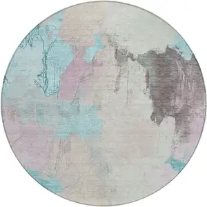 Photo of 8' Teal Blue And Beige Round Abstract Washable Indoor Outdoor Area Rug