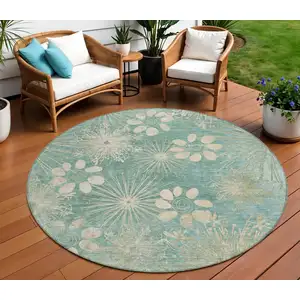 Photo of 8' Teal Blue And Beige Round Floral Washable Indoor Outdoor Area Rug
