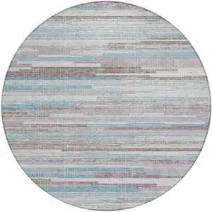 Photo of 8' Teal Blue And Beige Round Striped Washable Indoor Outdoor Area Rug