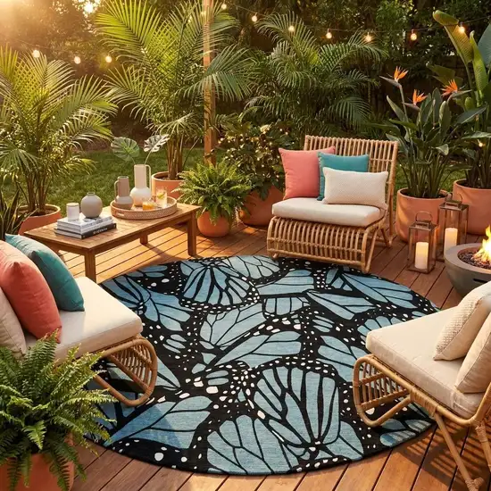 8' Teal Blue And Black Round Animal Print Washable Indoor Outdoor Area Rug Photo 1